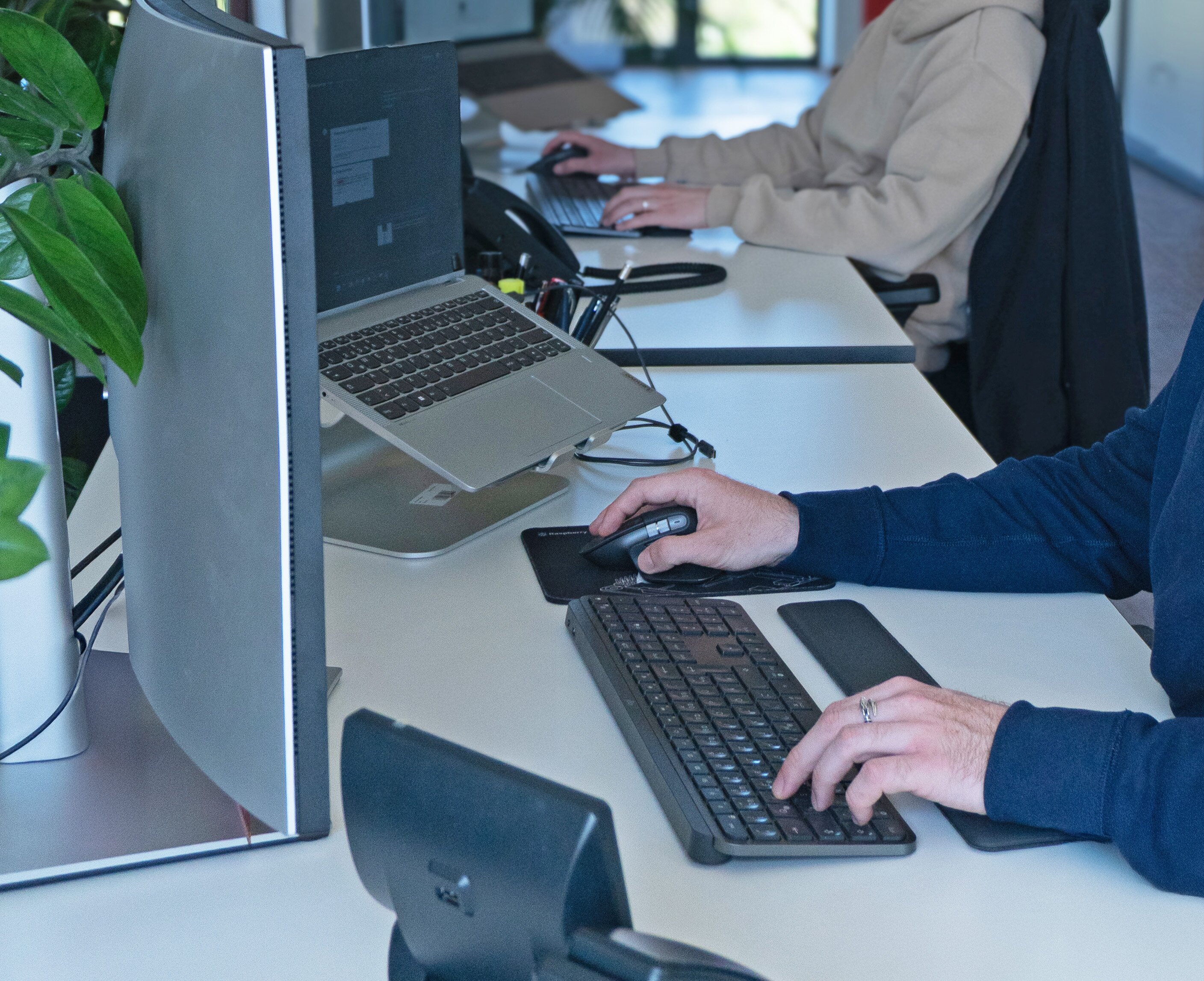 Welectron employees at their desks in the office