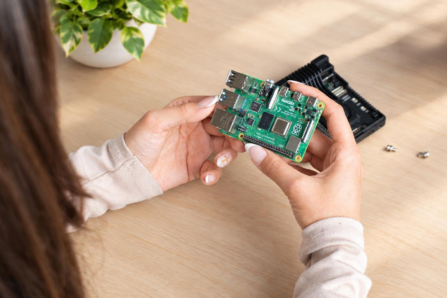 Raspberry Pi board in a hand